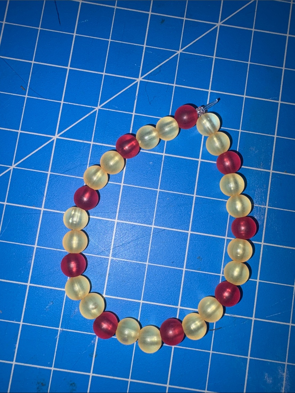 Red, and yellow bracelet kid size suggested age 8 to 12